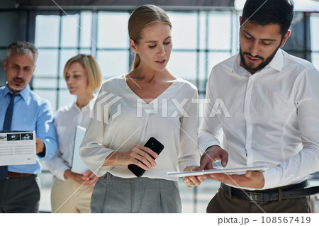 Business group working together on new project Business group working together on new project 108567419