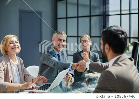 Multicultural professionals project managers group negotiating in boardroom at meeting. 108567446