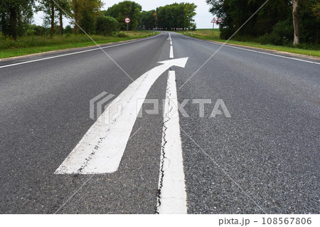 Asphalt road with markings and ending with a broken line Asphalt road with markings and ending with a broken line 108567806