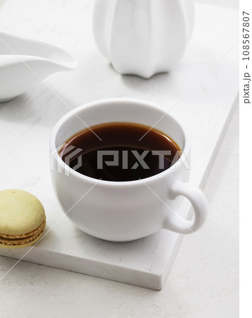 Cup of coffee with macaroons on the table Cup of coffee with macaroons on the table 108567807