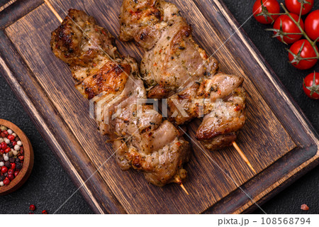 Delicious fried shish kebab of chicken or pork meat with salt, spices and herbs 108568794