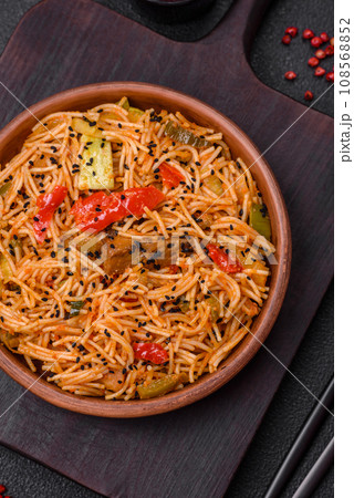 Delicious udon noodles with meat or seafood, vegetables, salt and spices Delicious udon noodles with meat or seafood, vegetables, salt and spices 108568852
