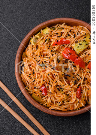 Delicious udon noodles with meat or seafood, vegetables, salt and spices Delicious udon noodles with meat or seafood, vegetables, salt and spices 108568869