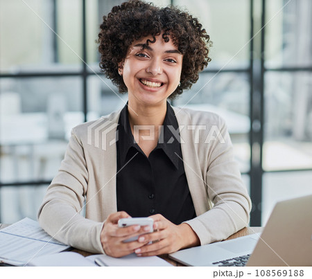 Portrait of Young Successful Caucasian Businesswoman Sitting at Desk Working on Laptop 108569188