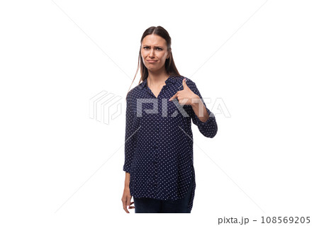 young charming positive successful woman with black hair dressed in a blue blouse young charming positive successful woman with black hair dressed in a blue blouse 108569205