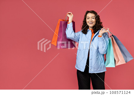 Woman with shopping bags in a jacket. 108571124