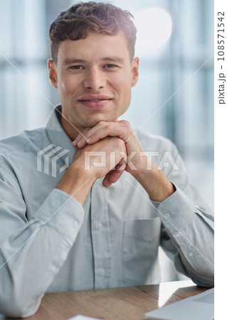 Shot of a young businessman using a laptop in a modern office Shot of a young businessman using a laptop in a modern office 108571542