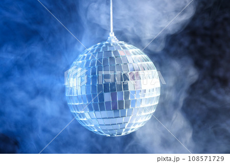 Disco ball in smoke on a dark background 108571729