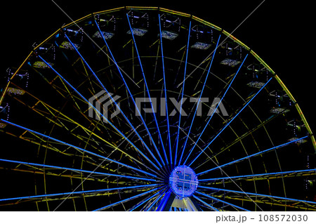 Amusement,pleasure. Illuminated ferris wheel,night Amusement,pleasure. Illuminated ferris wheel,night 108572030