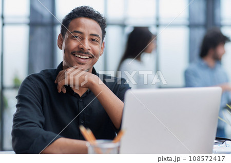 Business Professional Working at Office Desk Using Laptop 108572417