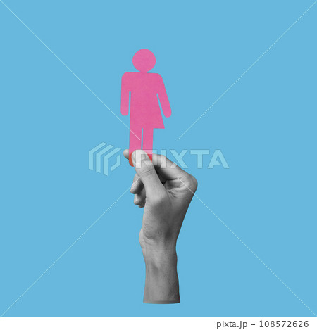 hand in black and white holding a gender neutral icon hand in black and white holding a gender neutral icon 108572626