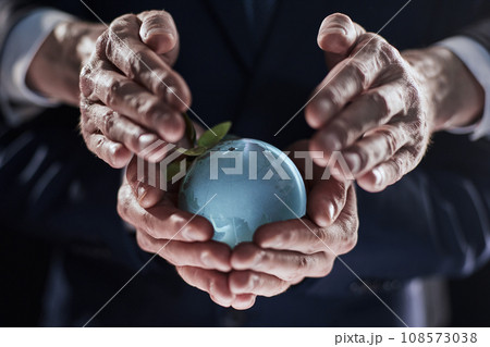 Glass Earth globe ib the hand. Ai generated 108573038