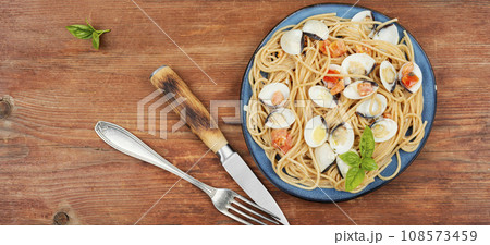 Pasta with fried clams, copy space. Pasta with fried clams, copy space. 108573459