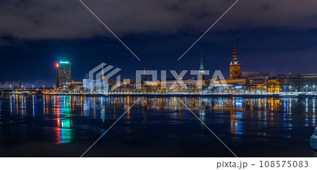 panorama of Old Riga evening view and illumination across the river 1 108575083
