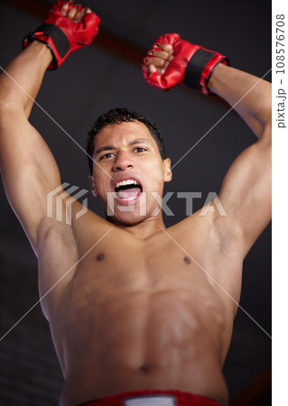 Celebration portrait, sports and MMA man scream, energy and cheers andfor gym achievement, success or kickboxing champion. Boxing winner, below view and boxer motivation, commitment and fight victory 108576708