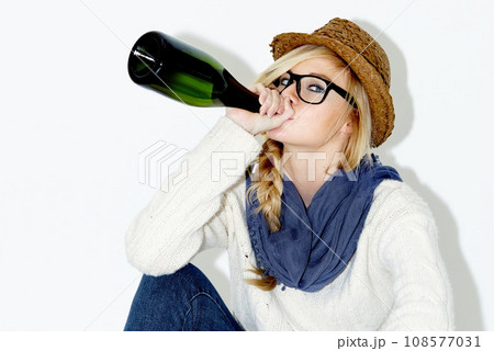 Fashion, drinking and woman with wine in studio with trendy, cool and stylish outfit and accessories. Alcohol, portrait and female model from Australia with edgy and casual style by white background. Fashion, drinking and woman with wine in studio with trendy, cool and stylish outfit and accessories. Alcohol, portrait and female model from Australia with edgy and casual style by white background. 108577031