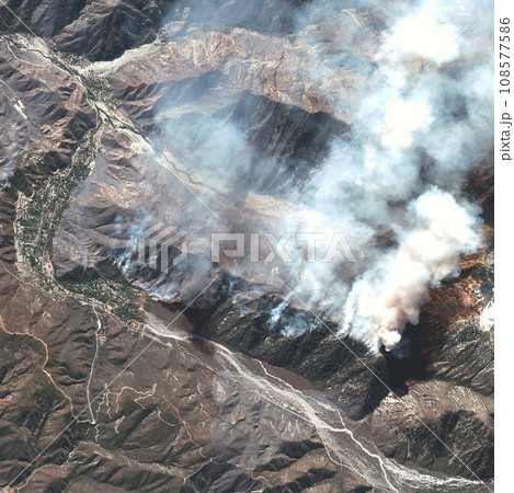Location, aerial landscape and volcano with smoke, satellite image and mountain range with fog. Nature, background and view from above with map and topography, Earth and geography with aerospace 108577586