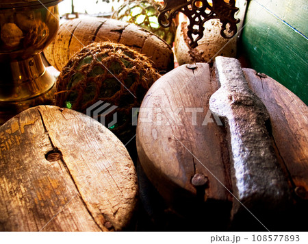 Closeup of fishing barrels, lines and rope, net and storage of traditional equipment at port. Tools, fishery and mesh, vintage wood and old metal, retro cordage and antique fishnet in industry 108577893