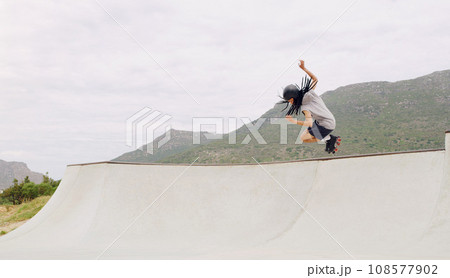 Sports, roller skates and jump with black man in skate park for fitness, exercise and skating hobby mockup. Summer, wellness and action with skater in outdoors for training, cardio and stunt Sports, roller skates and jump with black man in skate park for fitness, exercise and skating hobby mockup. Summer, wellness and action with skater in outdoors for training, cardio and stunt 108577902