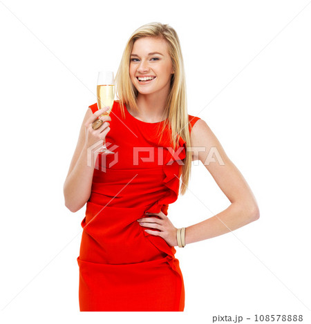 Portrait, champagne and toast with a woman in a red dress isolated on white background at an event, party or gala. Smile, success and glass of alcohol with a happy young person celebrating in studio Portrait, champagne and toast with a woman in a red dress isolated on white background at an event, party or gala. Smile, success and glass of alcohol with a happy young person celebrating in studio 108578888
