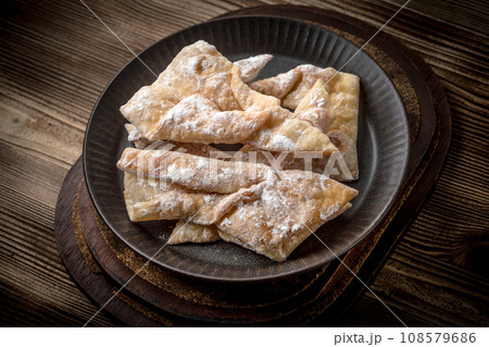 Faworki - traditional Polish crispy dessert. Faworki - traditional Polish crispy dessert. 108579686
