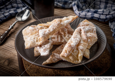 Faworki - traditional Polish crispy dessert. Faworki - traditional Polish crispy dessert. 108579690