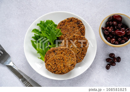 Vegan bean burgers, patties or cakes, top view. Vegan bean burgers, patties or cakes, top view. 108581025