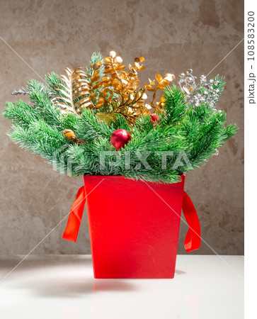 Layout of New Year's toys, accessories, gifts on a light wooden background. New Year background. 108583200