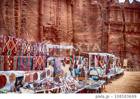 View of an open-air souvenir shop located along the Siq Canyon in the city of Petra, Jordan. View of an open-air souvenir shop located along the Siq Canyon in the city of Petra, Jordan. 108583689