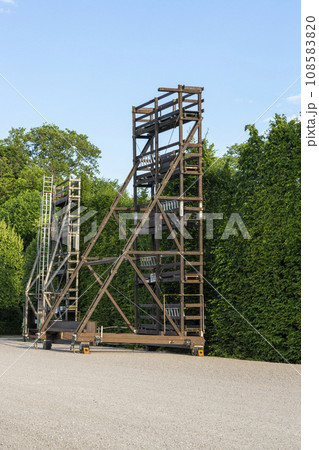 Construction for pruning trees and shrubs in the summer Imperial Palace Schoenbrunn Park 108583820