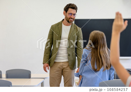 Male teacher and the kids at the history lesson Male teacher and the kids at the history lesson 108584257
