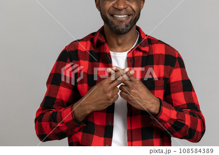 Unrecognizable black bearded man wearing red checkered shirt showing deaf-mute gestures 108584389