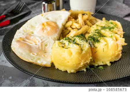 Fried eggs with boiled potatoes and yellow string beans. Fried eggs with boiled potatoes and yellow string beans. 108585673