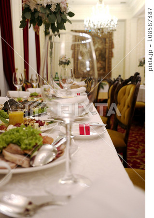 Glasses with wine. Filled with half and stand on the holiday table. restaurant. selective focus 108587387