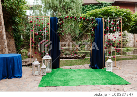 wedding arch. decorated white chairs at a wedding ceremony 108587547