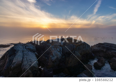 Rocky Shore on the Pacific Ocean Coast. Foggy Sunset. Victoria, Vancouver Island, BC, Canada. Rocky Shore on the Pacific Ocean Coast. Foggy Sunset. Victoria, Vancouver Island, BC, Canada. 108588212