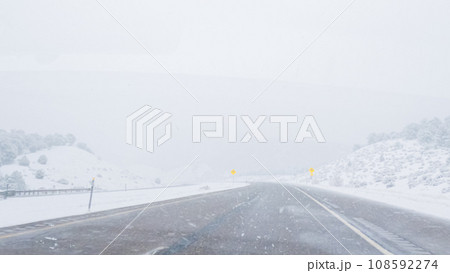 POV-Electric vehicle is captured deftly navigating the I-70 highway during a winter storm in Western Colorado. POV-Electric vehicle is captured deftly navigating the I-70 highway during a winter storm in Western Colorado. 108592274