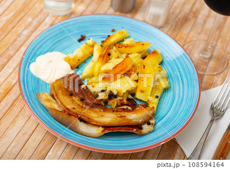 Roasted pork streaky bacon with baked potatoes Roasted pork streaky bacon with baked potatoes 108594164