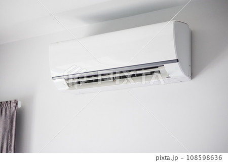 Air conditioner on white wall room interior background 108598636