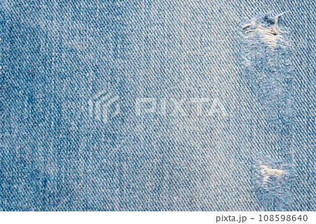 Denim blue jeans torn fashion design texture close up background top view Denim blue jeans torn fashion design texture close up background top view 108598640