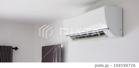 Air conditioner on white wall room interior background 108598726