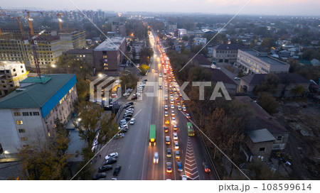 A crossroads with a lot of cars, buses and trucks 108599614
