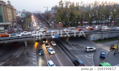 A crossroads with a lot of cars, buses and trucks 108599617