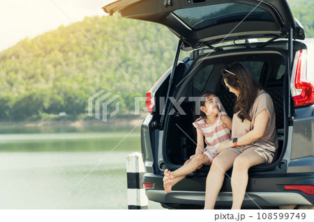 Summer vacation happy mother and daughter having fun. The concept of family on vacation and travel. Summer vacation happy mother and daughter having fun. The concept of family on vacation and travel. 108599749