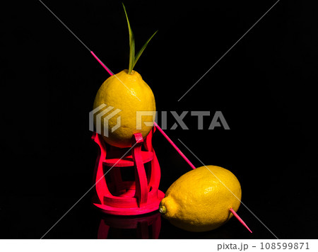 Composition with two lemons on a black background 108599871