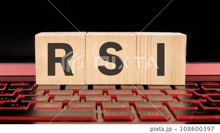 RSI Relative Strength Index written on wooden cubes on the laptop keyboard 108600397