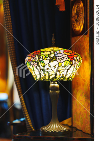 Tiffany's interior table lamp with a shade. Tiffany's interior table lamp with a shade. 108602614