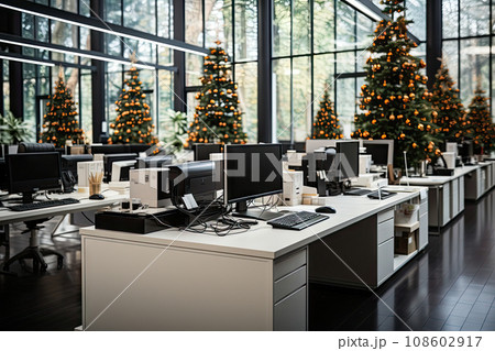 an office with christmas trees in the background and two computers on desks facing each other workstations, 108602917