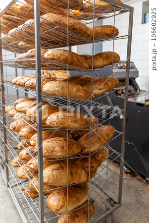 Fresh bread with golden crust 108602925