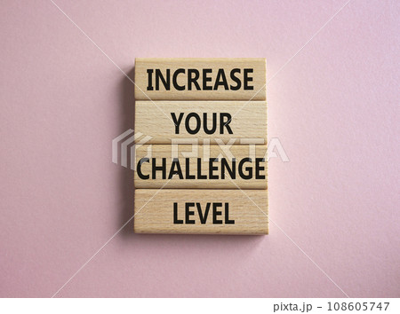Challenge Level symbol. Concept word Increase your Challenge Level on wooden blocks. Beautiful pink background. Business and Increase your Challenge Level concept. Copy space Challenge Level symbol. Concept word Increase your Challenge Level on wooden blocks. Beautiful pink background. Business and Increase your Challenge Level concept. Copy space 108605747